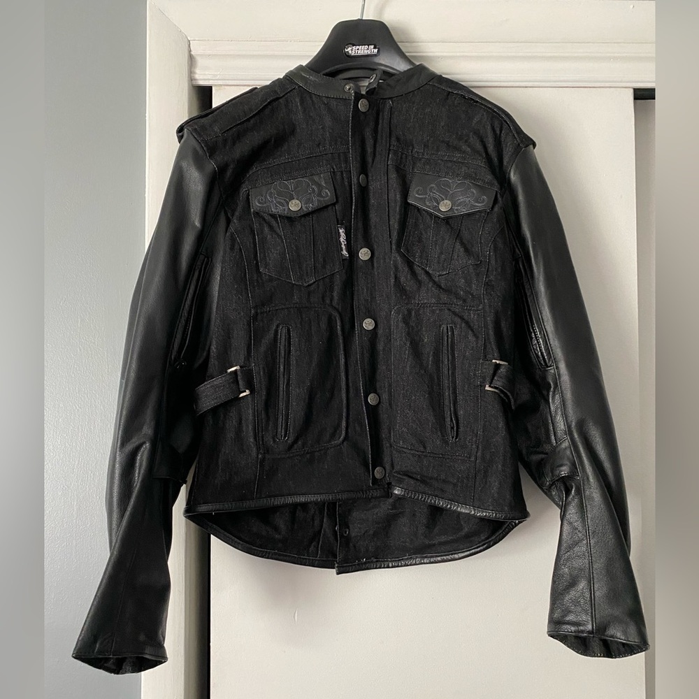 Denim and leather women’s medium Speed and Strength motorcycle jacket.